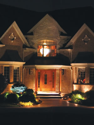 Isn't this a welcoming site to come home to? Landscape lighting is easy to install and makes your home safer and more welcoming.