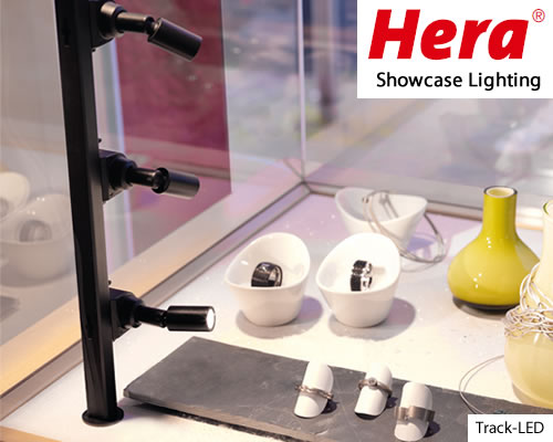 HERA Track-LED Showcase Lighting This product is great for any display case, especially those with glass shelving. You mount the “track” vertically, then attach individual spotlights. The spotlights swivel to direct the light exactly where you want.