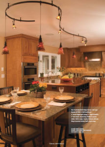 Eat-in kitchen with Tech Lighting Antique Bronze Two-Circuit Monorail with Tortoise Shell Ovation Pendants with Iron Wrap Accessories and 3" Aero Heads with Amber Round Glass Shield Accessories