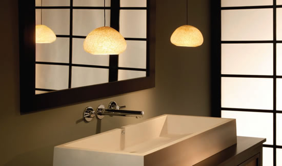 River Rock Wedge Pebble Brown Pendants on Free Jack 4" Round Flush Canopies in Antique Bronze suspended to each side of the sink in a contemporary bath
