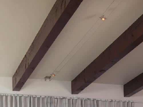 Tech Lighting Kable with K-Hello Lights Cable Lighting on a ceiling with exposed beams