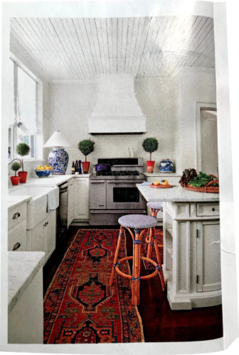 Even the kitchen uses a blue and white lamp, a large ginger jar on the counter - Southern Living January 2018, article by Elizabeth Passarella with photographs by Hector Manuel Sanchez.