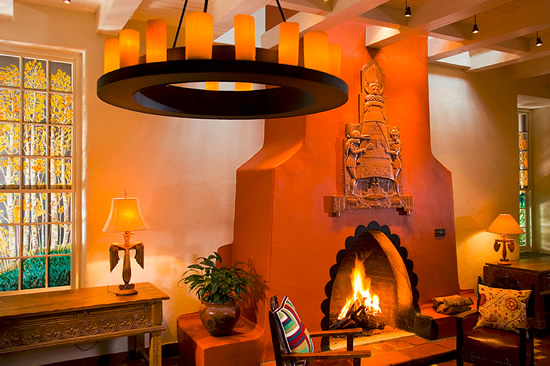 La Fonda on the Plaza in Sante Fe, NM The fireplace, designed by Arnold Rönnebeck, is inspired by traditional beehive shaped fireplaces built into the adobe walls. Photo by Atakra - Southwestern Architecture and Décor – myDesign42