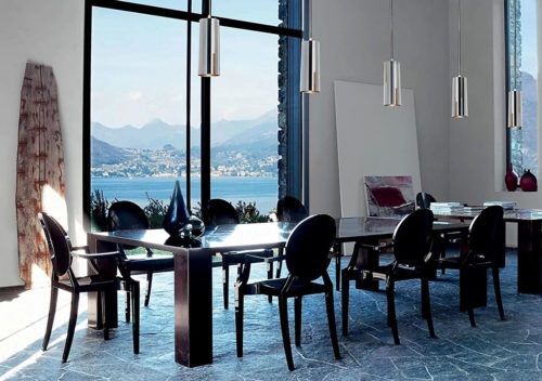 Residential dining room with Louis Ghost Chairs around a contemporary table