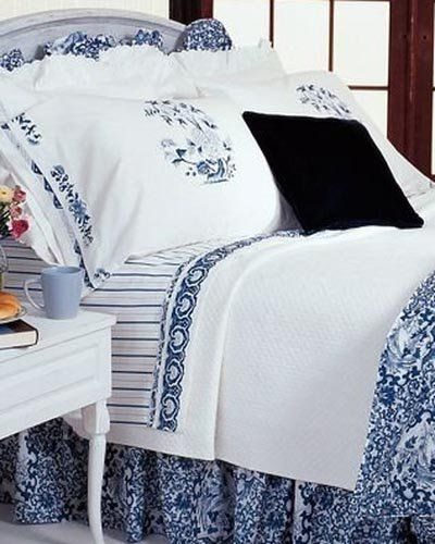 Ralph Lauren Oriental Influenced Bedding - Comforter, dust ruffle and ruffled pillow shams in Ralph Lauren Tamarind Blue with Jonquil Striped Sheets, White pillow cases and Medallion Pattern pillow cases - Ralph Lauren Chinese Pattern in Blue and White with stylized flowers, leaves and Chinese dragons or sea serpents - Ralph Lauren Chinoiserie