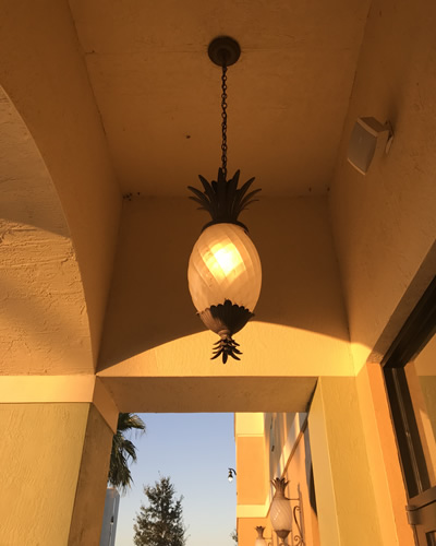 The hanging lantern is 12.5" wide, 28.5" tall - Pineapple Lighting at Pollo Tropical – myDesign42