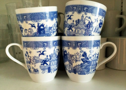 CalamityWare Mugs have giant fish, pterodactyls, a 4-armed robot, flying saucers, the sasquatch, giant frogs and probably more. - CalamityWare: Fun Twist on Blue Willow – myDesign42