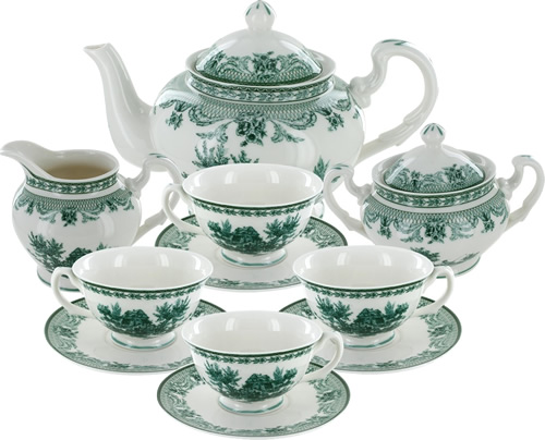 Green Toile Tea Set includes four cups, four saucers, a sugarbowl with lid, cream pitcher and teapot with lid.