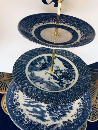 3-Tier Cake Stand Cake Stands Boutique on eBay with Asian motifs The top looks like it is made from a Churchill Blue Willow saucer. The bottom seems to be an Asian pattern platter. The middle seems to be a plate with a blue and white chinoiserie pattern. - Blue Willow 2-Tier and 3-Tier Servers and Cake Stands - myDesign42