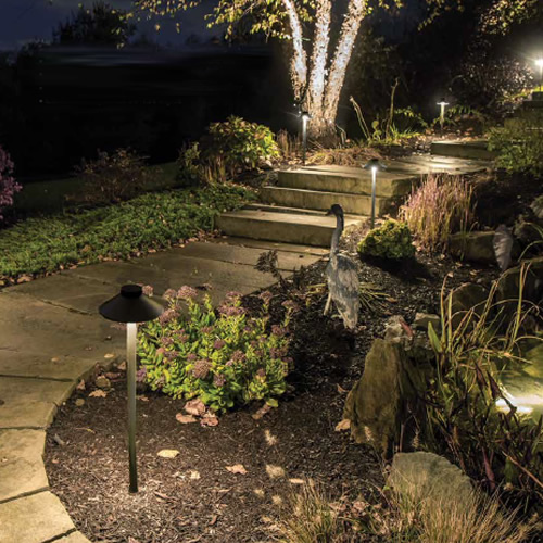 The sleek linear design of WAC Lighting TIKI Path Light works well to light pathways or flower beds.