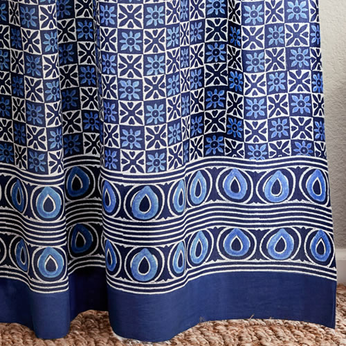 Saffron Marigold Starry Nights: Batik print with a simple rustic white star like patterning grounded in deep indigo blue.