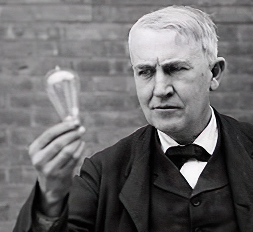 Edison holding a light bulb