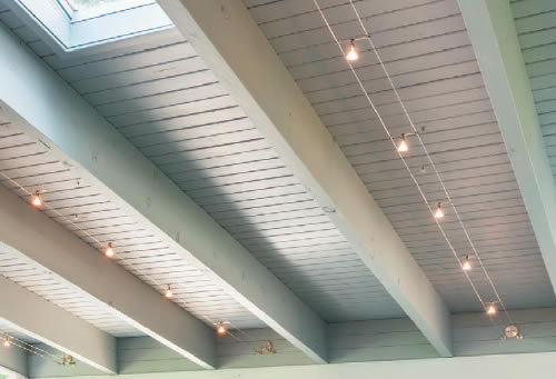 Tech Lighting Kable with K-Pivot Lights Cable Lighting on a ceiling with exposed beams