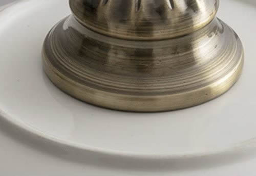 The pendant looks like a real bowl has a hold drilled in it to fit an antique brass socket set.