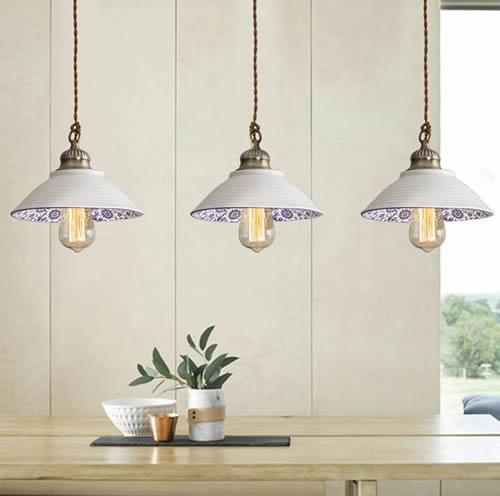 Three Farmhouse Blue and White Porcelain Bowl Pendants over a long table