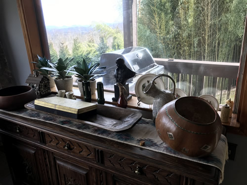 Carved cabinet and western decor for sale at the Auction Preview at Indian Cave Lodge