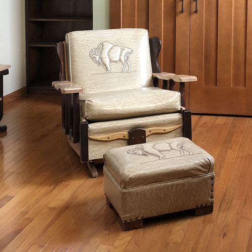 Buffalos and a long horn steer on a chair and footstool at the Auction Preview at Indian Cave Lodge