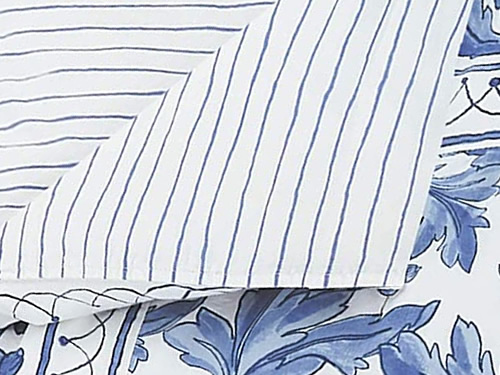 Molly Hatch Blue Bird Bedding has white with blue crayon stripes on the other side.