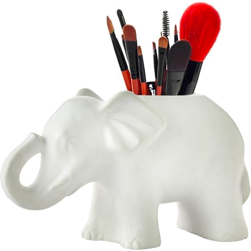 Vern Yip Shangri La Elephant holds makeup brushes