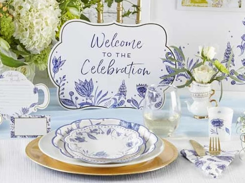 Kate Aspen Blue Willow Paper Plates and napkin, Place Card, Welcome to the Celebration Sign, Blue Willow framed Wedding Guest Book Alternative, votive tea light holder in frosted glass with Blue Willow motifs and an "Advice for the Bride" Blue Willow Teapot Wedding Advice Card