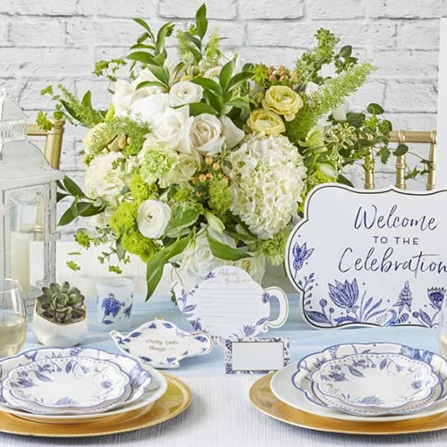 Kate Aspen Blue Willow Paper Plates, Welcome to the Celebration Sign, Blue Willow Teapot Pretty Little Things Trinket Dish and Wedding Advice Cards and a votive tea light holder in frosted glass with Blue Willow motifs