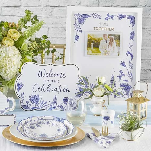 Kate Aspen Blue Willow Paper Plates and napkin, Place Card, Welcome to the Celebration Sign, Blue Willow framed Wedding Guest Book Alternative and a votive tea light holder in frosted glass with Blue Willow motifs