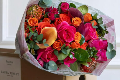 Laura Ashley Rosalie Garden Bouquet A vibrant mix of bright pink and orange, silver, and lush green